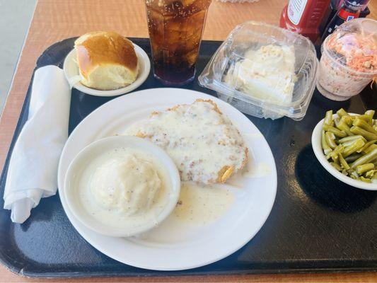 Chicken fried steak, mashed potatoes, roll, green beans