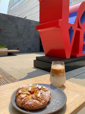 Almond croissant, iced latte, and love