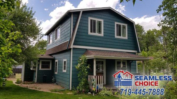 Engineered wood siding with LP SmartSide shingles on the gable end. Colorado Springs.