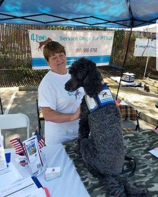 Master dog trainer Terry Sandhoff and her service dog Shasta at a veterans PATRIOT DAY public event.