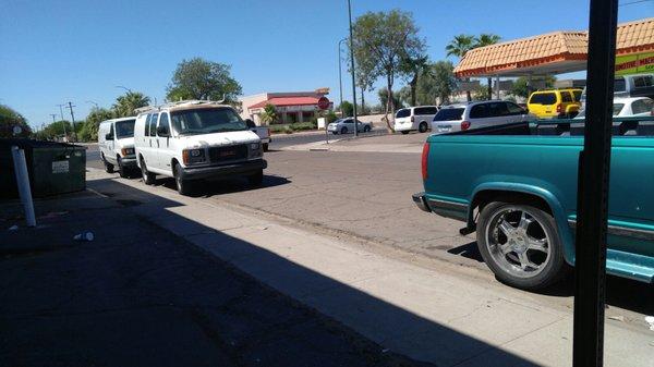 Street parking is used for company van and automotive business across the street.