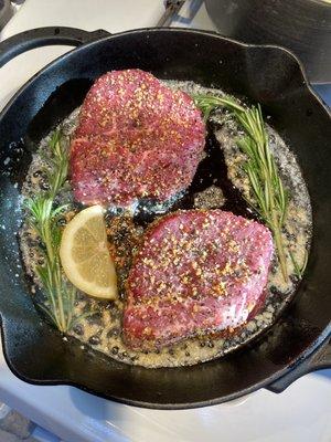 Cast iron/oven prime filets. Salt, pepper, garlic, cooked in butter, RoseMary & citrus. Amazing flavor cooked at medium rare.