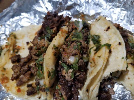 Nasty, crispy, old, rancid, oily carne asada that I didn't even ask for. Look for yourself at the taco furthest to the left.  Disgusting