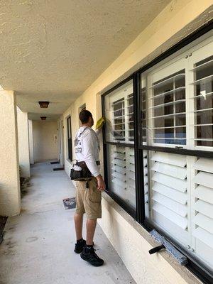 Window cleaners cleaning window in Hobe Sound