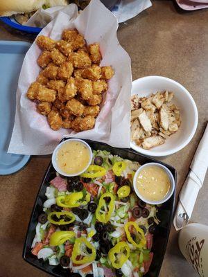 Full order of tots, Sicilian Salad with a side of grilled chicken.  Free fizzy water!