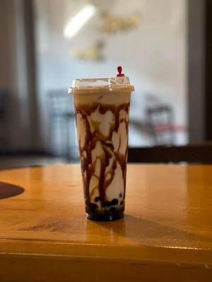 Creme Brulé milk tea with tapioca boba pearls- for adults there is an option to add a shot of your favorite liquor.