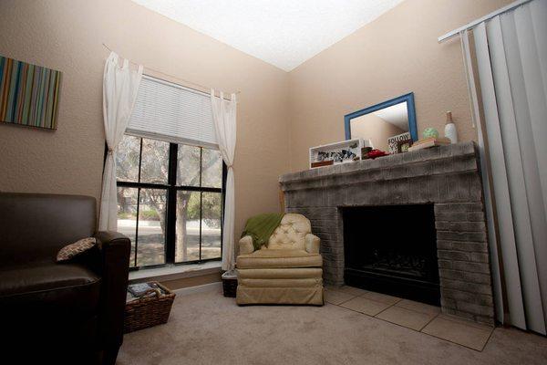 They later painted the fireplace and walls for us as part of our lease renewal. Walls repainted to light grey and fireplace to dark grey.