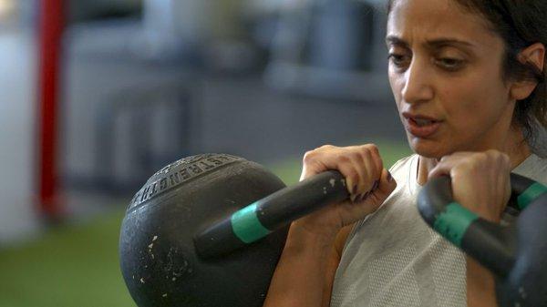 Walking lunge, with kettle bell in rack position.