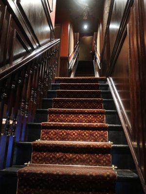 Staircase to upstairs dining room.