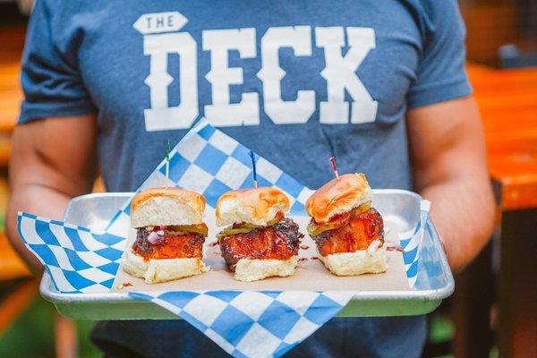 Deck Sliders: smoked brisket, st. louis bbq sauce, coleslaw, fried pickles, hawaiian sweet roll