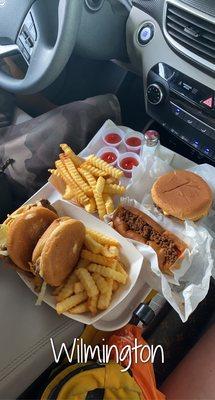 Cheeseburgers, chili dog, and fries