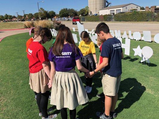 HCA students praying for our Community!