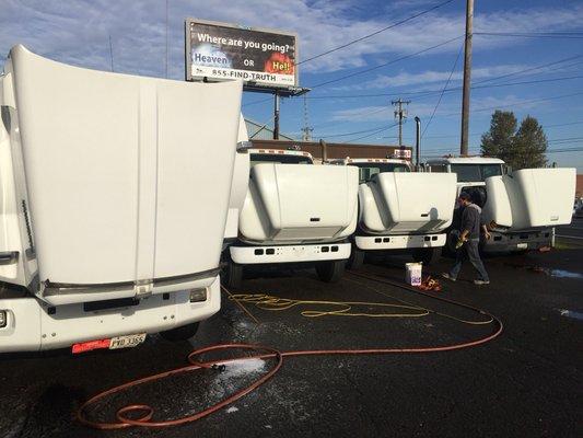 Prepping semi trucks to get detailed.