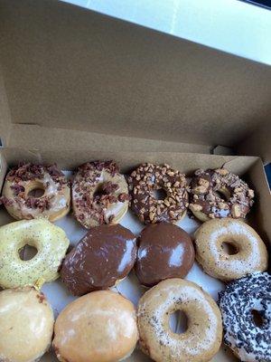 One dozen of Sugar Rush Doughnuts. A delicious treat that is nothing short of wonderful.