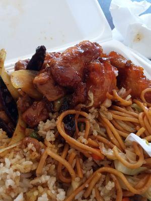 Orange chicken, spicy chicken and half rice & chow mein w/ soda Yummmmmy!!!!