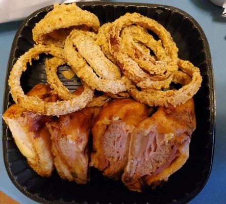 Monte Cristo sandwich with onion rings.