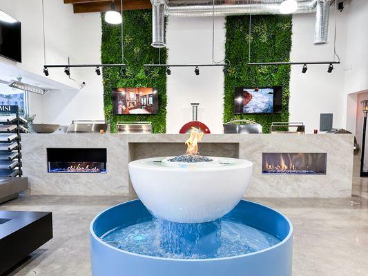 Water Fall Feature with Gas Firepit, Outdoor Fireplaces, Fireplaces, Grass Wall in Showroom.