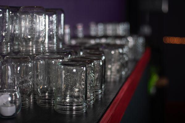 Mason jars behind the bar.