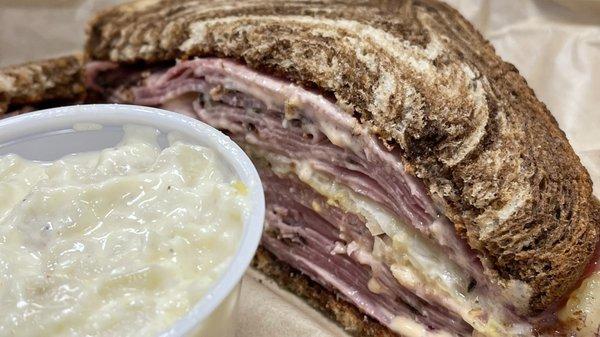 Pastrami reuben on rye.  Double meat with spicy brown mustard.  A side of potato salad.