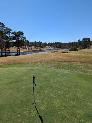 Main practice putting green with view of the Legacy and Heritage 9th holes in the background. Scenic.