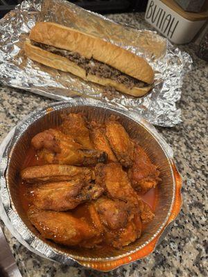 Lg. Steak and Cheese Sub and hot wings.