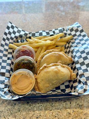 featuring your choice of two delicious empanadas paired with a side of perfectly seasoned rice, crispy fries, and a fresh salad.