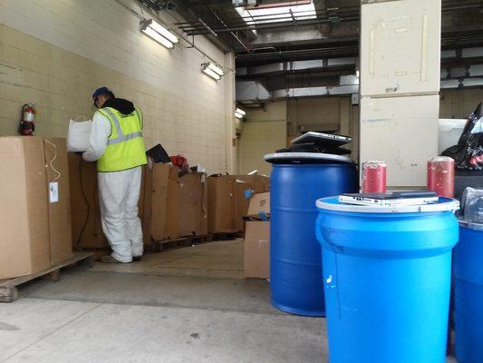 Hazmat suited staff remove waste directly from the trunk of your car!