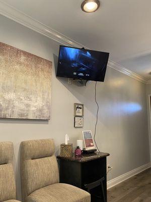 Cozy Waiting Room with Star Wars playing on the telly