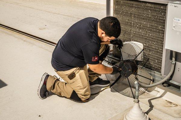 K&S HVAC technician doing maintenance for one of our commercial clients.