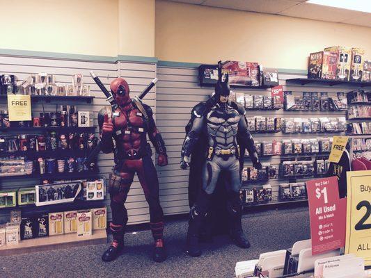 Life size dead pool and batman