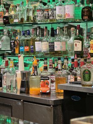 Open liquor bottles on bar