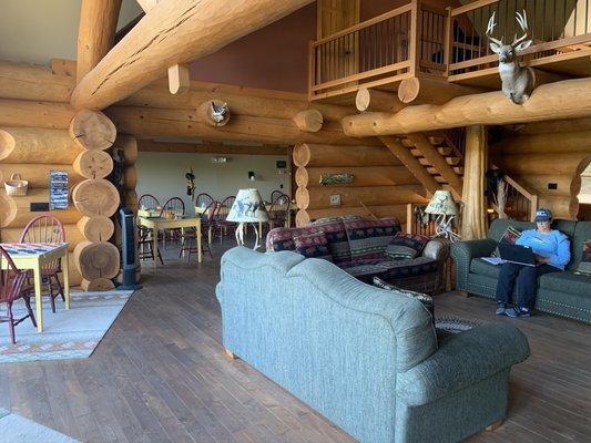 Living room with games that turn into breakfast tables with back porch views