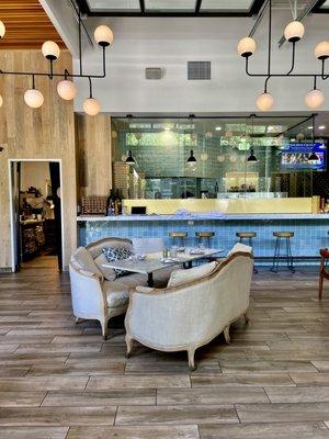 Interior with big brick pizza oven in kitchen.