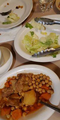 Salad with oil and vinegar dressing and the other side varies, this time it was the lamb stew