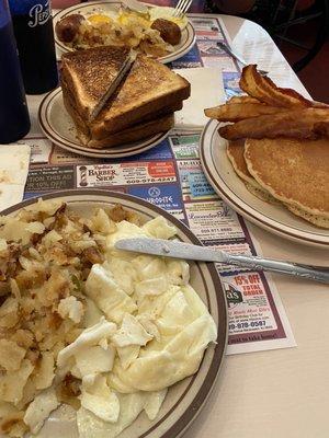 Egg whites with bacon, home fries with a side of toast. Also a short stack of pancakes