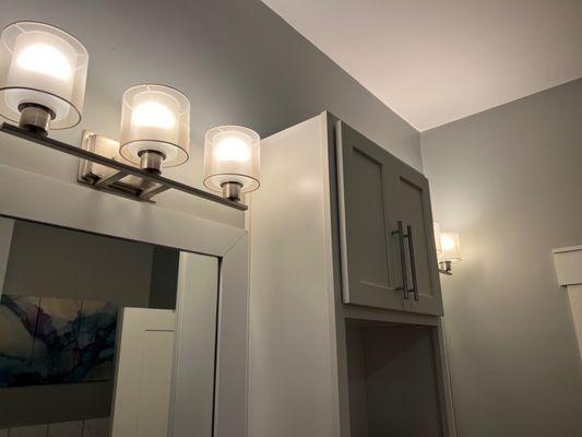 Tons of lighting and storage in bathroom