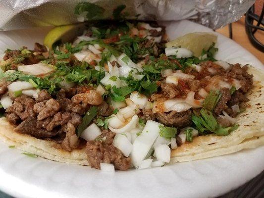 Tacos were bomb.  Fresh tortillas, plenty of meat, cilantro, and onion.