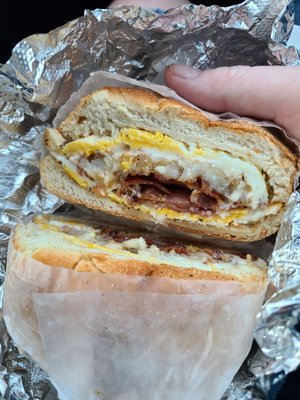 Bacon, egg, hash brown and cheese on a hard roll