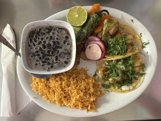 Delicious shrimp tacos with pickled vegetables and piping hot black beans; fluffy rice. It's my " last meal" meal.