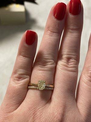 Oval diamond with a golden hue to match the wedding band - designed both to match.