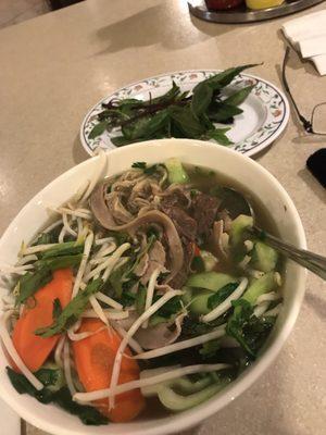 A Customized beef and vegetable dish with extra basil.