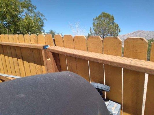 Fence fell over into neighbors yard.