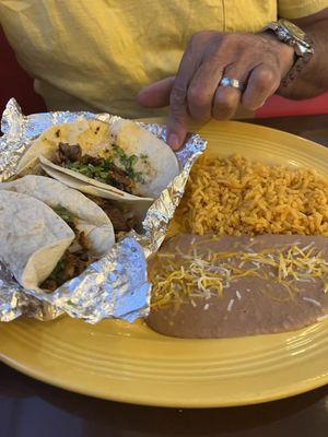 Street tacos with refried beans and rice