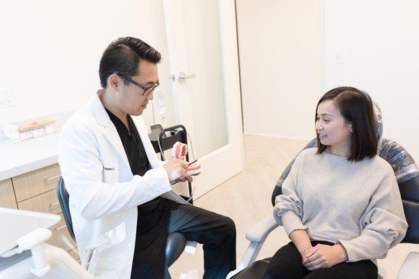 Family Dentist Dr. Isaac Sun Assisting Dental Patient