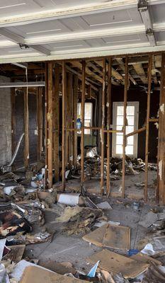 Removal of insulation, stucco, flooring and drywall.