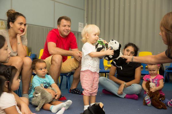 In our My Grownup & Me classes, babies and children explore concepts through toys and music, fostering development in a fun and engaging way