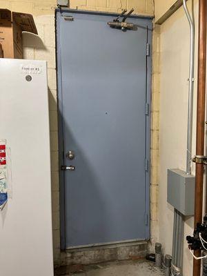 Old commercial steel door that was internally cracked and the hardware was broken. Our client decided to replace the door. See next photo.