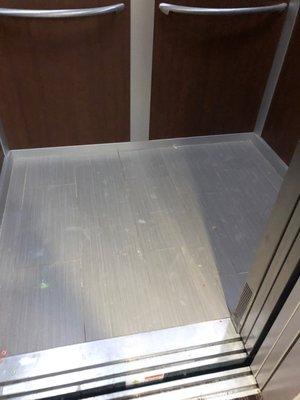 Elevator floor was covered in dirt and cereal