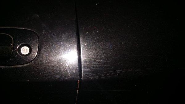 Cadillac Express Car Wash left these horizontal scratches in my rear quarter panel. They also ripped my rear view mirror off