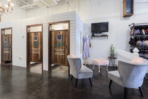 Seated lounge with TV in the fitting rooms.